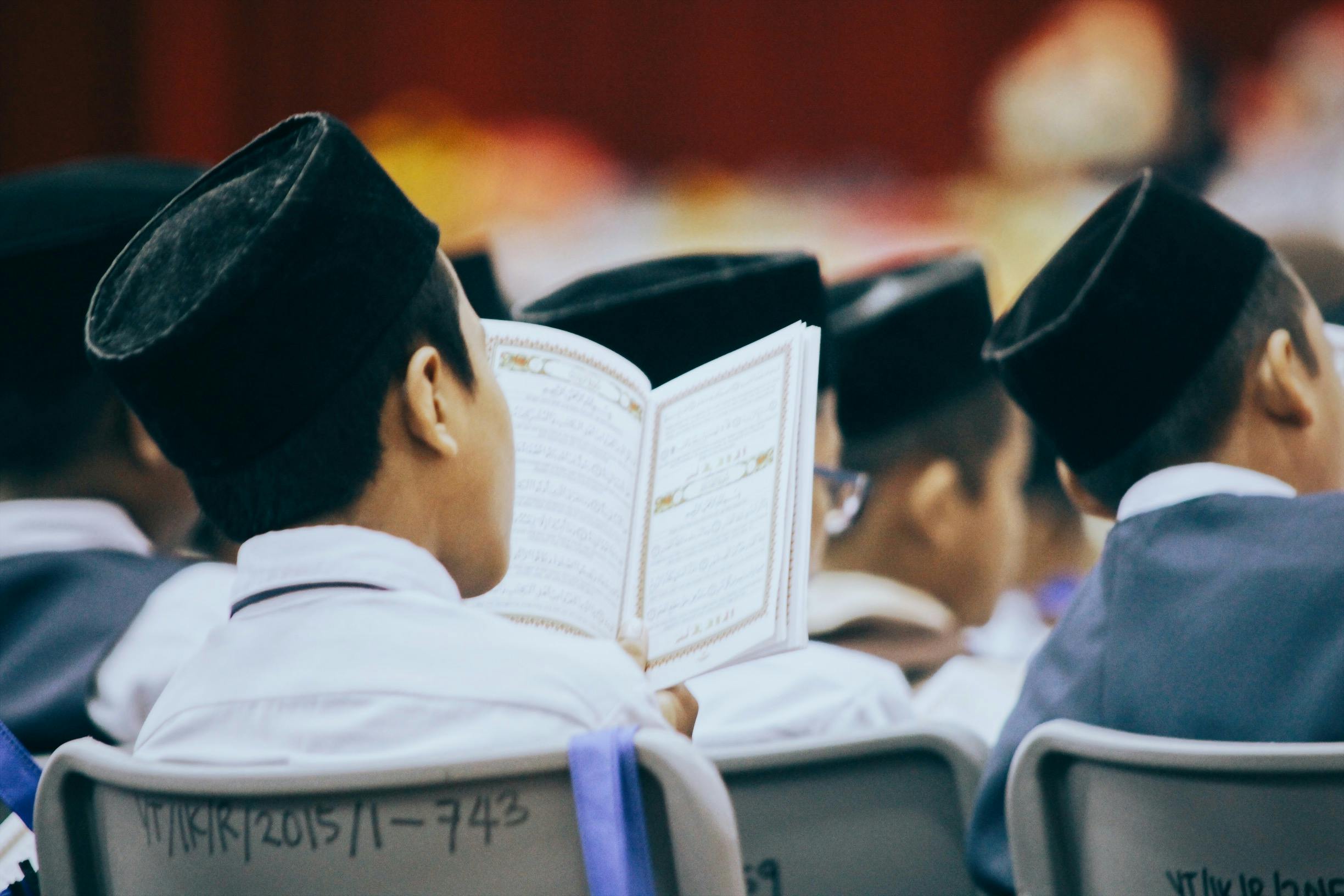 Photo-Of-Person-Reading-Quran