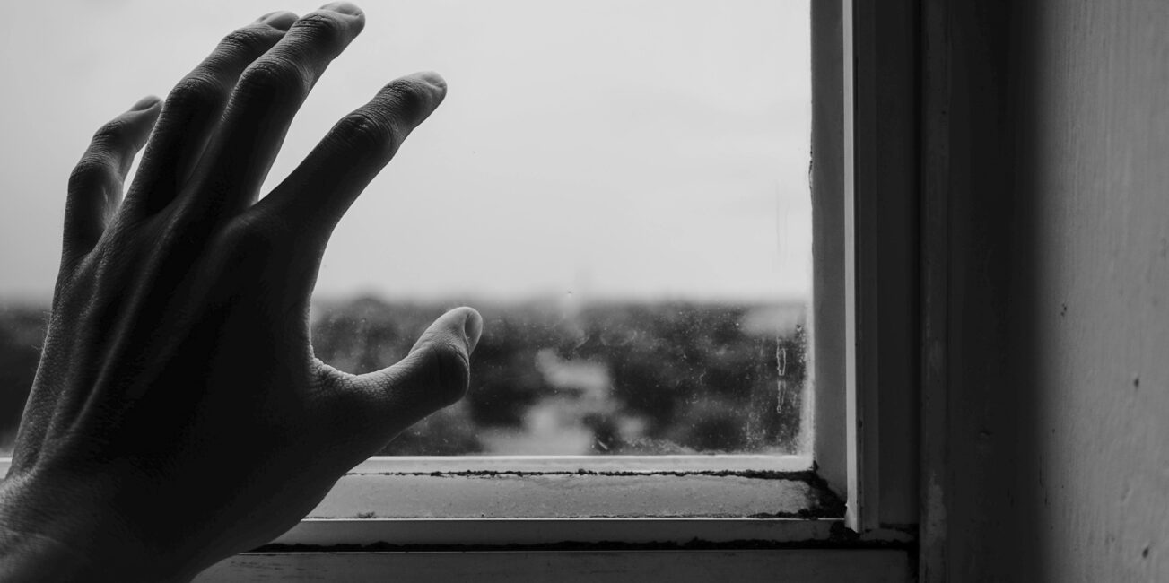 Close-up-of-hand -near-window