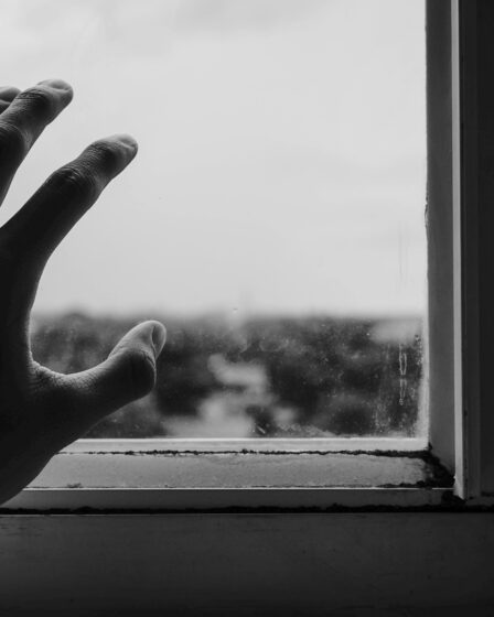 Close-up-of-hand -near-window