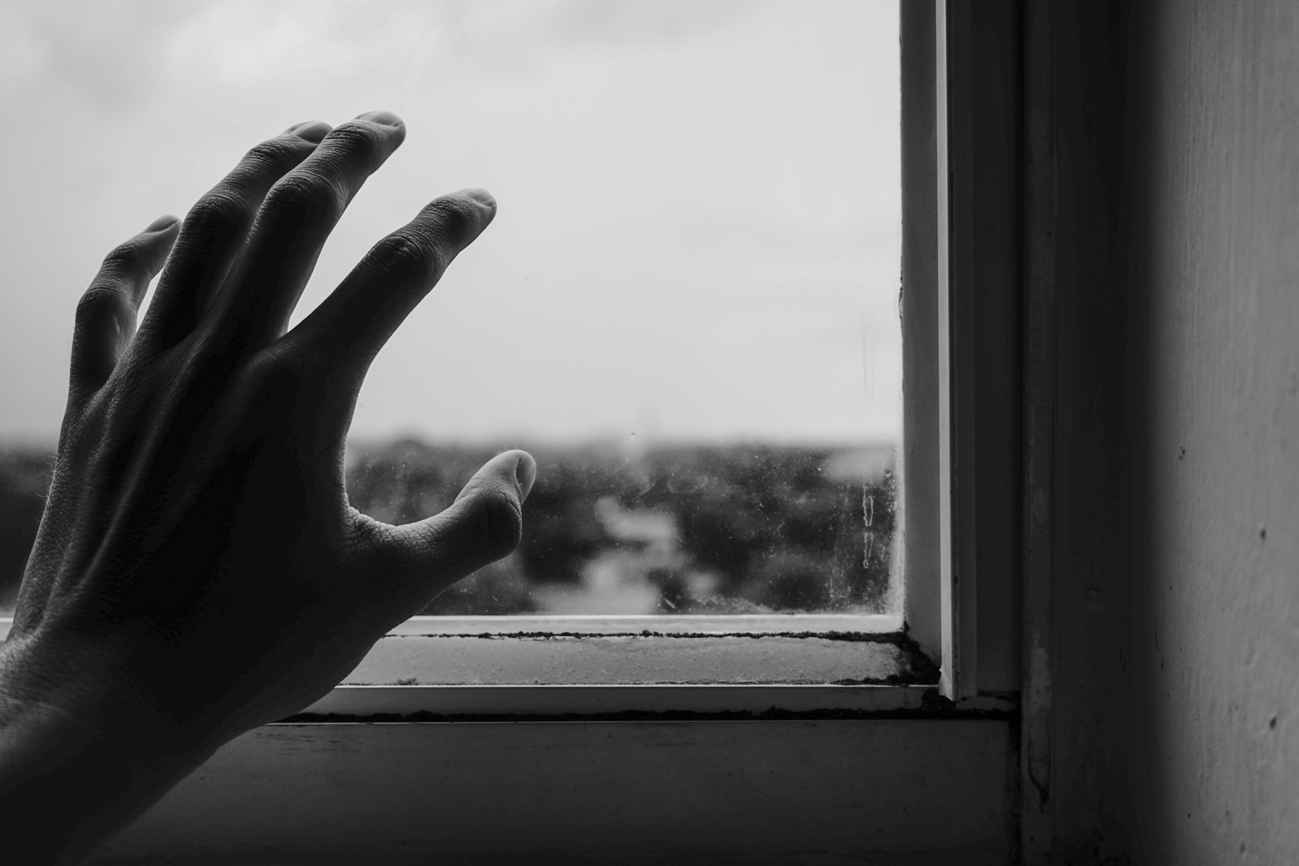 Close-up-of-hand -near-window